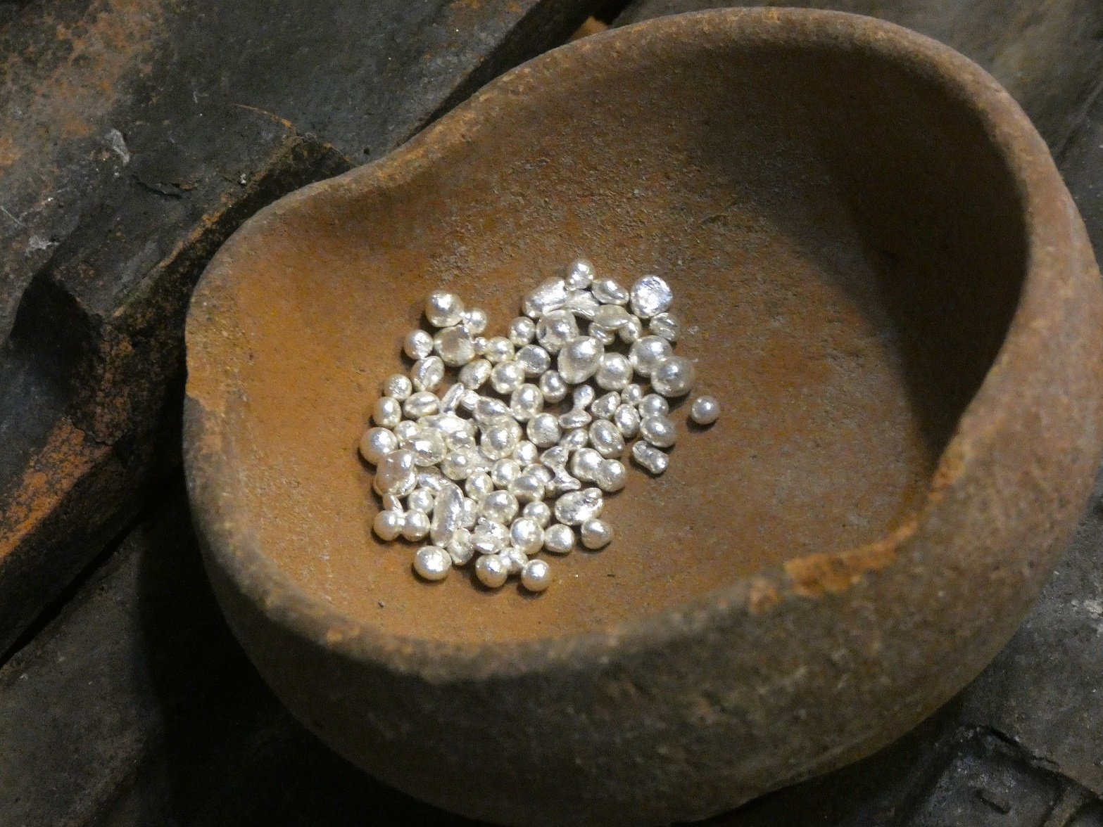 Pure silver granules in a crucible